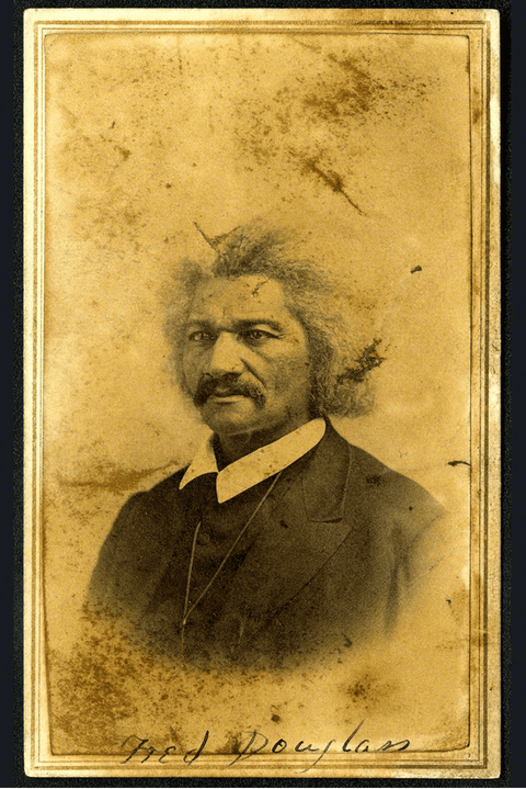 Carte-de-visite studio portrait of Frederick Douglass, pictured from the chest up wearing a dark sui