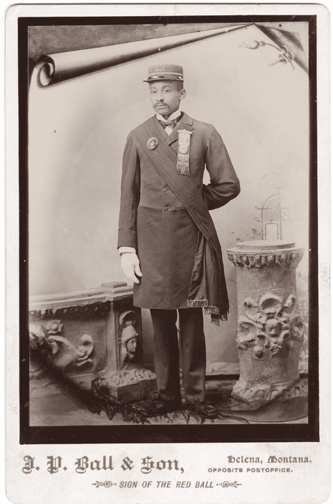 Studio portrait (full body) of William C. Irvin, a black man with a mustache, wearing a uniform. Irv