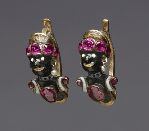 The focal point of this pair of earrings rests upon the intricately designed heads resembling Africa